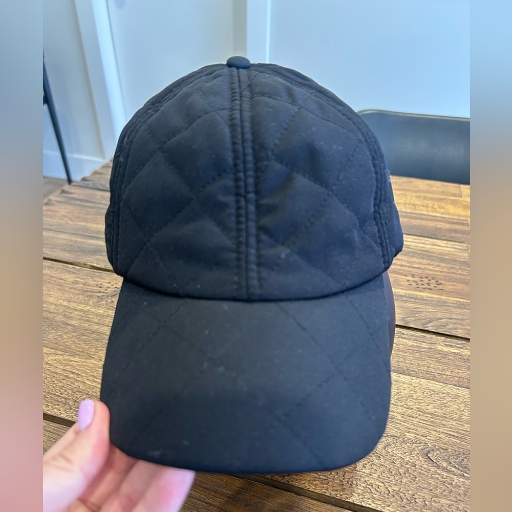 Minimalist quilted black baseball cap. Velcro adjustable.